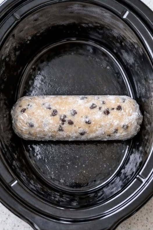 Toss a frozen raw cookie dough log into the slow cooker along with three simple ingredients, and you’ll have a treat so delicious your family will be asking for more.
